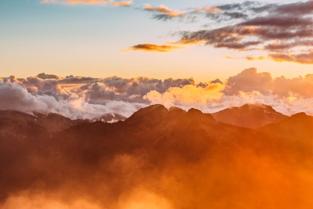 mountains-sun-clouds-warm